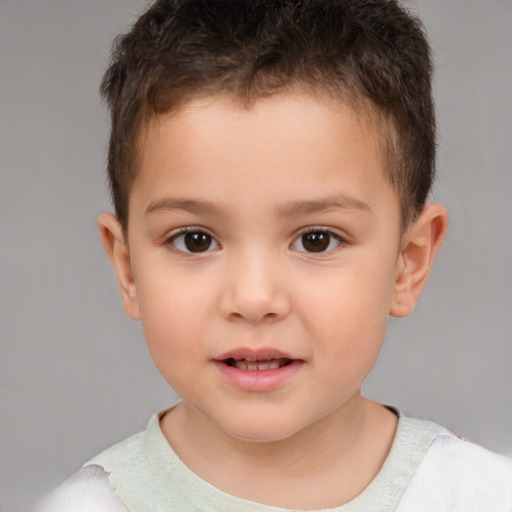 Joyful white child male with short  brown hair and brown eyes