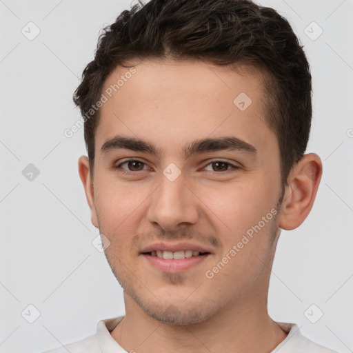 Joyful white young-adult male with short  brown hair and brown eyes