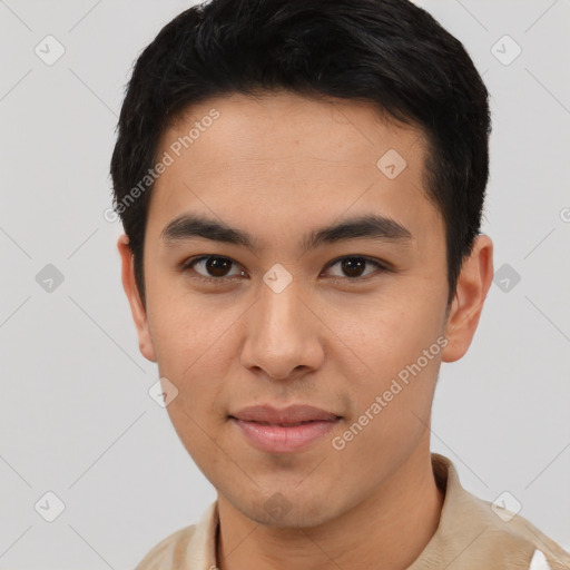 Joyful asian young-adult male with short  brown hair and brown eyes