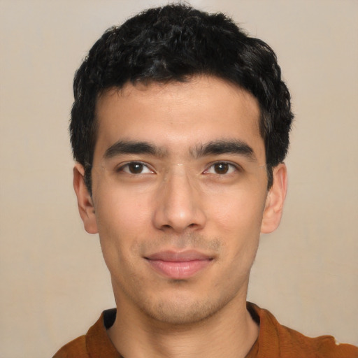 Joyful asian young-adult male with short  black hair and brown eyes