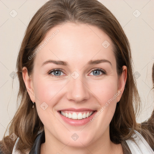 Joyful white young-adult female with medium  brown hair and blue eyes