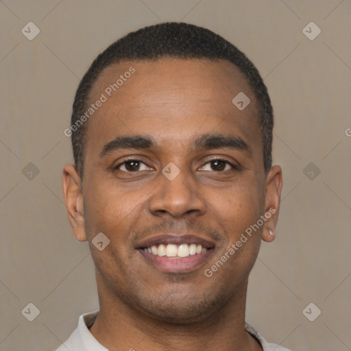 Joyful latino young-adult male with short  brown hair and brown eyes