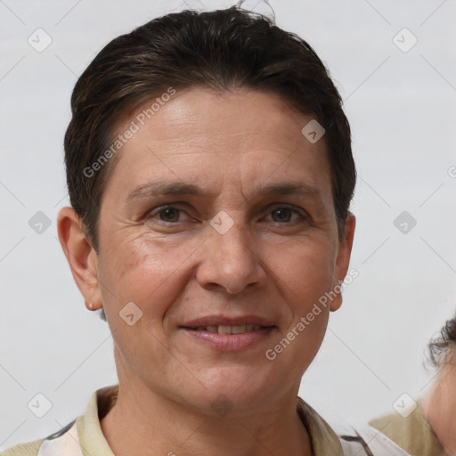 Joyful white adult female with short  brown hair and brown eyes