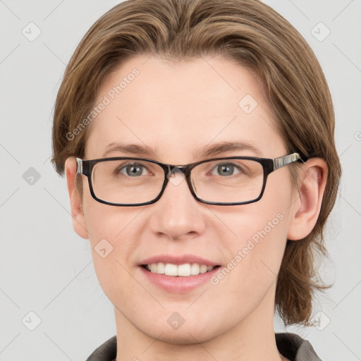 Joyful white young-adult female with medium  brown hair and blue eyes