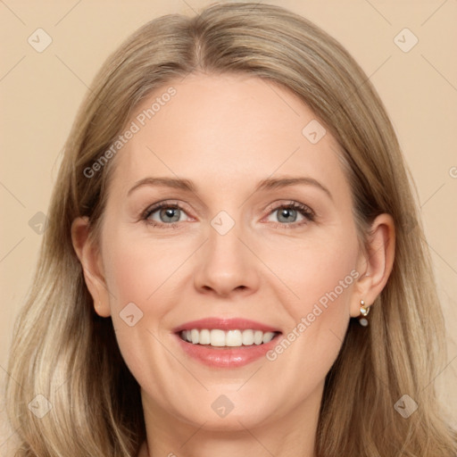 Joyful white adult female with long  brown hair and grey eyes