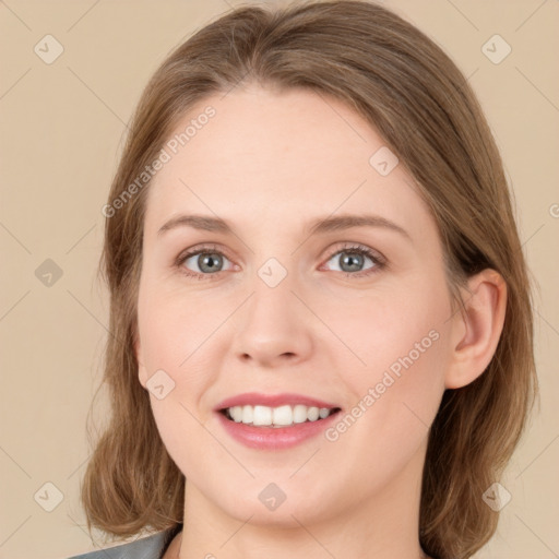 Joyful white young-adult female with medium  brown hair and green eyes