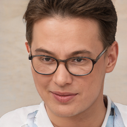 Joyful white adult male with short  brown hair and brown eyes