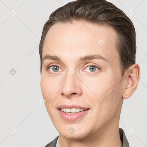 Joyful white young-adult female with short  brown hair and grey eyes