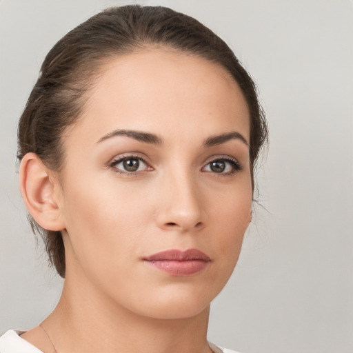 Neutral white young-adult female with medium  brown hair and brown eyes