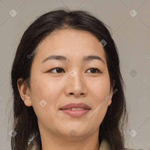 Joyful asian adult female with medium  brown hair and brown eyes