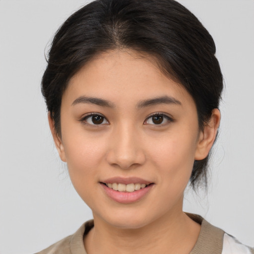 Joyful white young-adult female with medium  brown hair and brown eyes