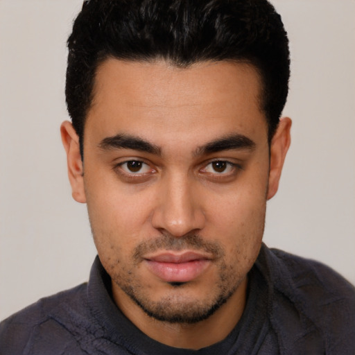 Neutral latino young-adult male with short  black hair and brown eyes