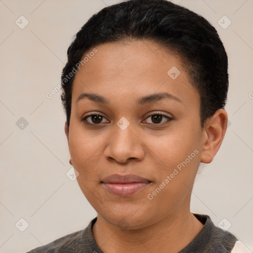 Joyful black young-adult female with short  black hair and brown eyes