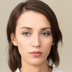 Neutral white young-adult female with medium  brown hair and green eyes