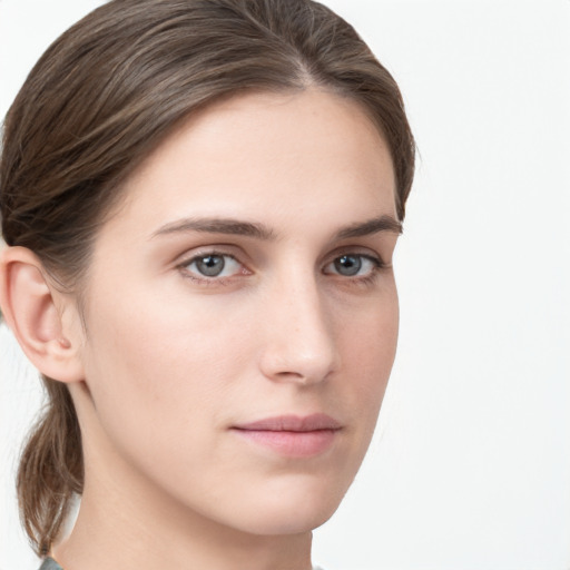 Neutral white young-adult female with medium  brown hair and grey eyes