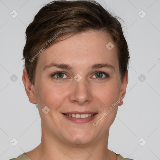 Joyful white young-adult female with short  brown hair and grey eyes