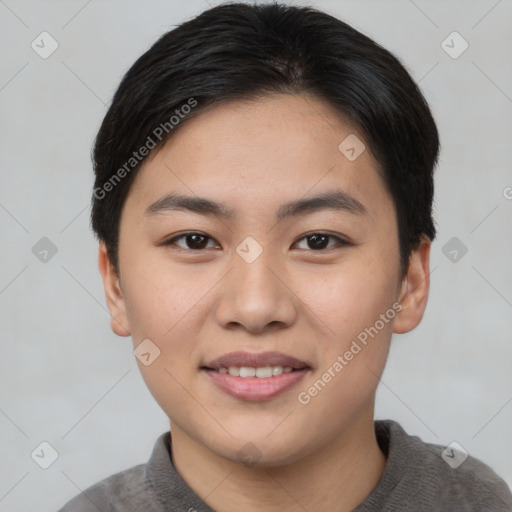 Joyful asian young-adult female with short  brown hair and brown eyes