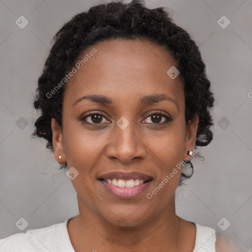 Joyful black young-adult female with short  brown hair and brown eyes