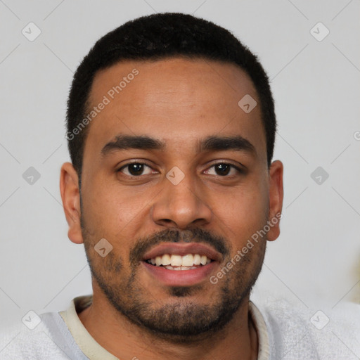 Joyful latino young-adult male with short  black hair and brown eyes