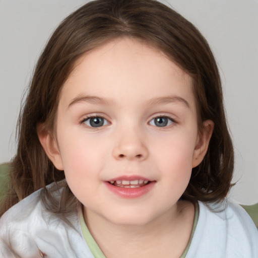 Joyful white child female with medium  brown hair and blue eyes