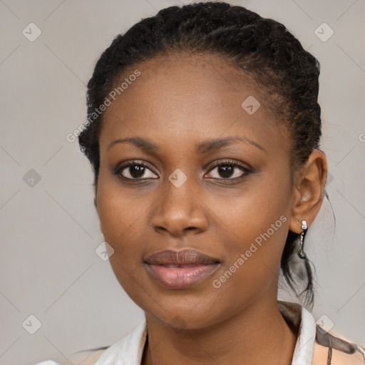 Joyful black young-adult female with medium  black hair and brown eyes