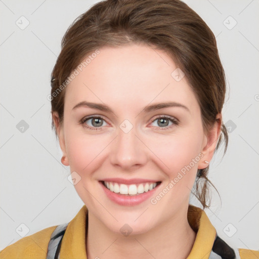 Joyful white young-adult female with medium  brown hair and blue eyes