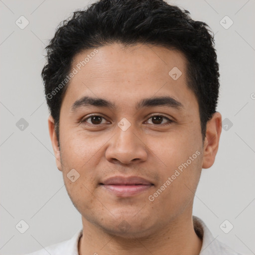 Joyful latino young-adult male with short  black hair and brown eyes