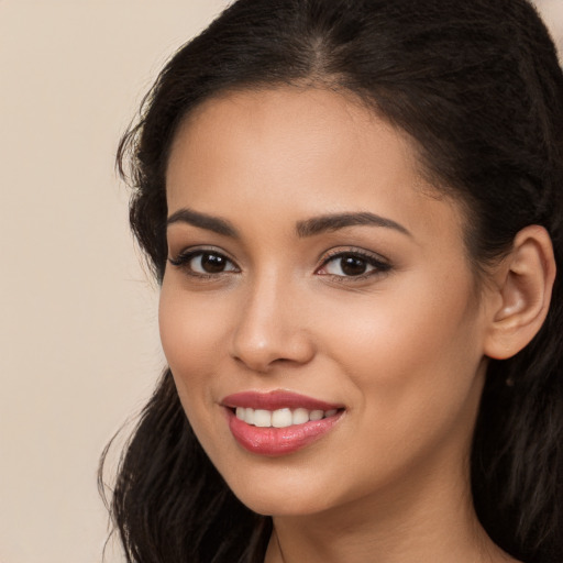 Joyful white young-adult female with long  brown hair and brown eyes