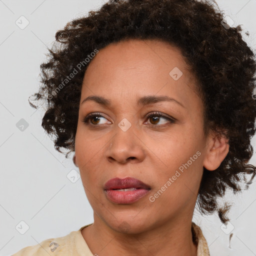 Joyful black young-adult female with medium  brown hair and brown eyes