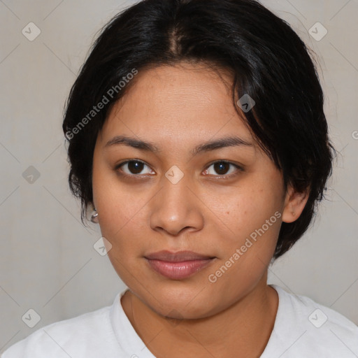 Joyful latino young-adult female with medium  brown hair and brown eyes