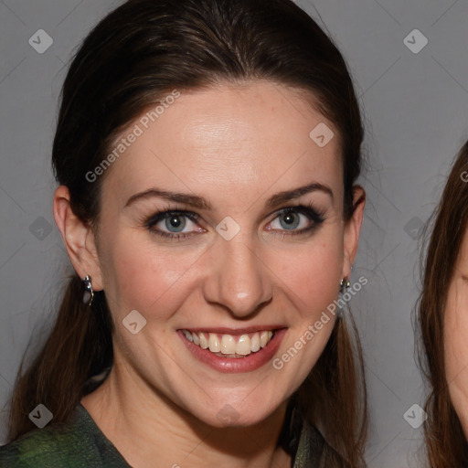 Joyful white adult female with medium  brown hair and blue eyes