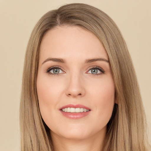 Joyful white young-adult female with long  brown hair and green eyes