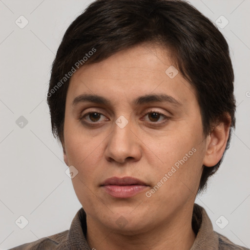 Joyful white adult female with short  brown hair and brown eyes