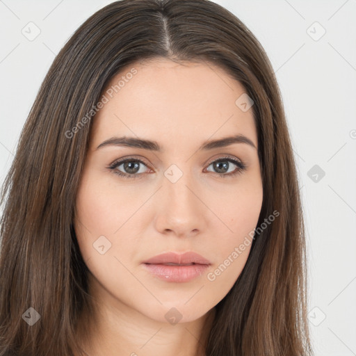 Neutral white young-adult female with long  brown hair and brown eyes