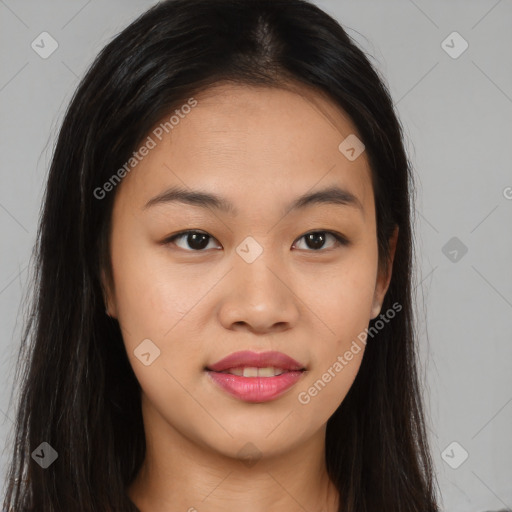 Joyful asian young-adult female with long  brown hair and brown eyes