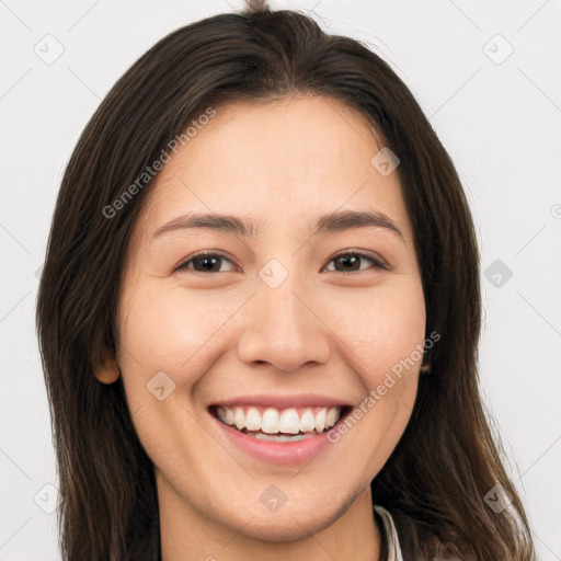 Joyful white young-adult female with long  brown hair and brown eyes