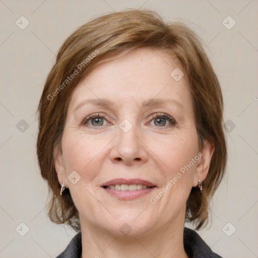 Joyful white adult female with medium  brown hair and grey eyes