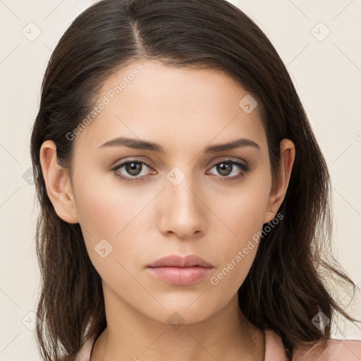 Neutral white young-adult female with long  brown hair and brown eyes