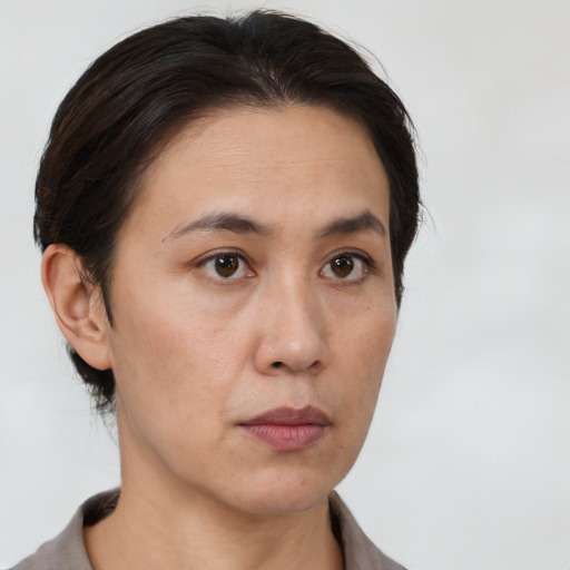 Neutral white young-adult female with short  brown hair and brown eyes