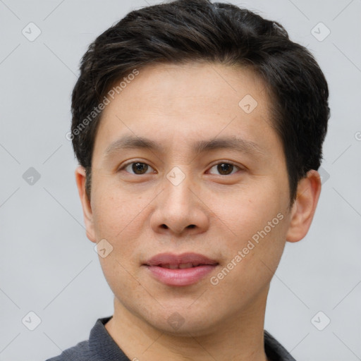 Joyful asian young-adult male with short  brown hair and brown eyes