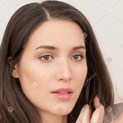 Neutral white young-adult female with long  brown hair and brown eyes