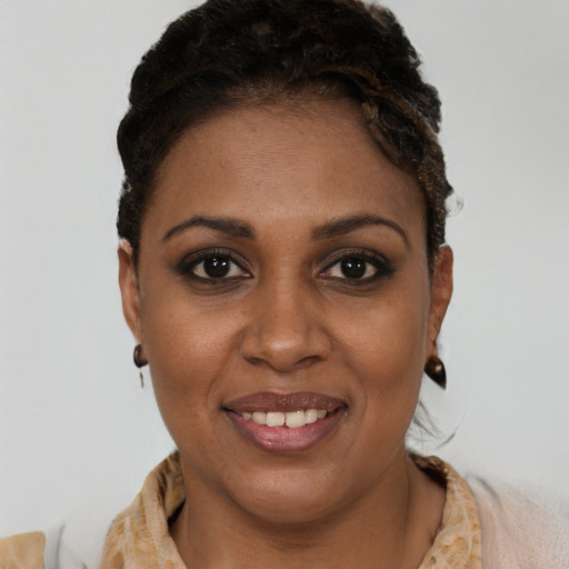 Joyful black young-adult female with short  brown hair and brown eyes
