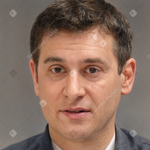 Joyful white middle-aged male with short  brown hair and brown eyes