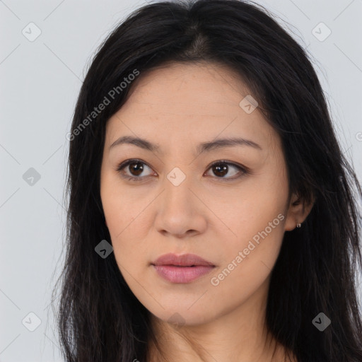 Joyful asian young-adult female with long  brown hair and brown eyes