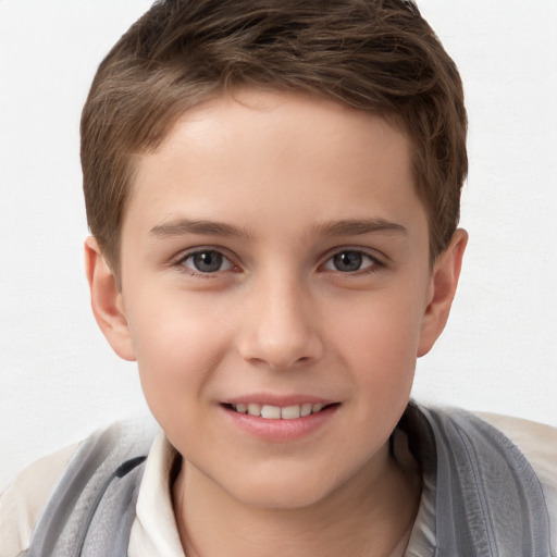 Joyful white child male with short  brown hair and brown eyes