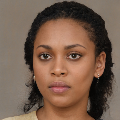 Neutral black young-adult female with long  black hair and brown eyes