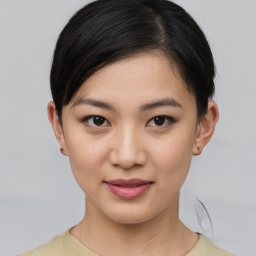 Joyful white young-adult female with medium  brown hair and brown eyes