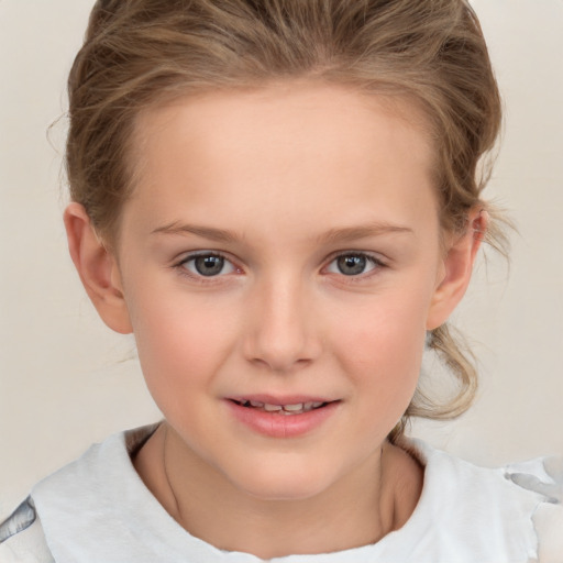 Joyful white child female with medium  brown hair and brown eyes