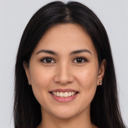 Joyful white young-adult female with long  brown hair and brown eyes