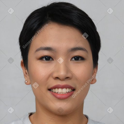 Joyful asian young-adult female with short  black hair and brown eyes